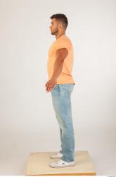 Whole body orange tshirt light blue jeans of Harold
